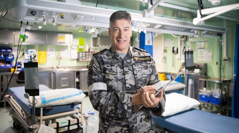 Lieutenant Commander Wesley Truscott in the sick bay on board HMAS Canberra. Story by Lieutenant Nancy Cotton. Photo by Leading Seaman Matthew Lyall.