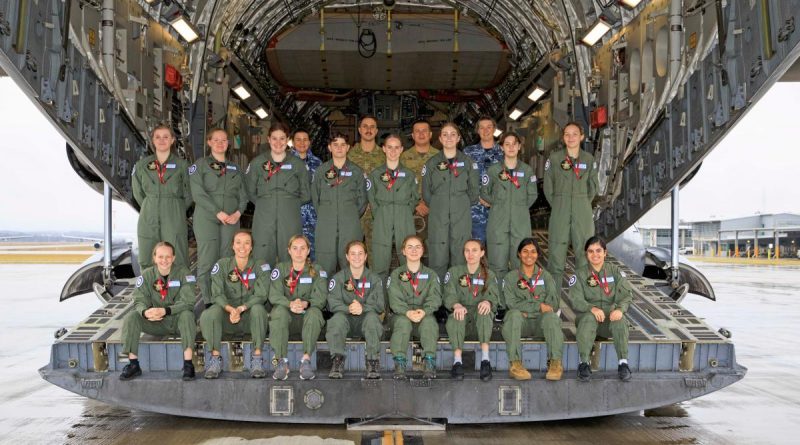 Participants in the 2022 Air Force Women in Aviation Program and their guides on the ramp of a C-17A Globemaster at RAAF Base Amberley. Story by Corporal Melina Young. Photo by Corporal Brett Sherriff.