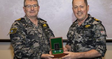Commander Fleet Air Arm Commodore David Frost, right, presents Lieutenant Ian Donovan with the Federation Star for 40 years of service at a presentation ceremony at HMAS Albatross. Story by Lieutenant Danielle Worthey. Photo: Petty Officer Justin Brown.