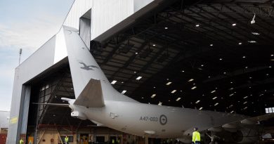 A RAAF P-8A Poseidon is marshalled out of the No. 11 Squadron maintenance hangar by ground crew at RAAF Base Edinburgh. Photo by Leading Aircraftman Sam Price.