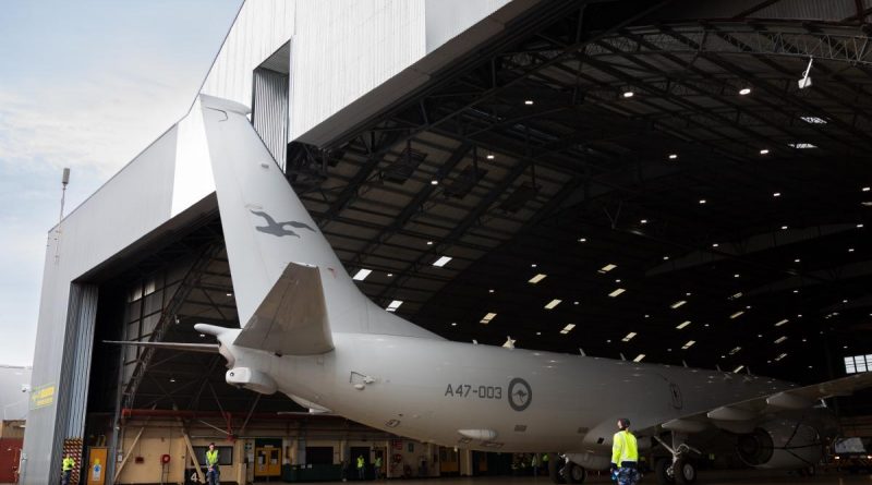 A RAAF P-8A Poseidon is marshalled out of the No. 11 Squadron maintenance hangar by ground crew at RAAF Base Edinburgh. Photo by Leading Aircraftman Sam Price.