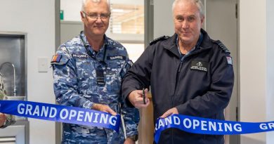 Squadron Leader Paul Summers, left, and Group Captain Anthony Stainton cut the ribbon at the grand opening of the Williamtown Allied Health Services building. Story by Corporal Melina Young. Photo by Leading Aircraftman Samuel Miller.