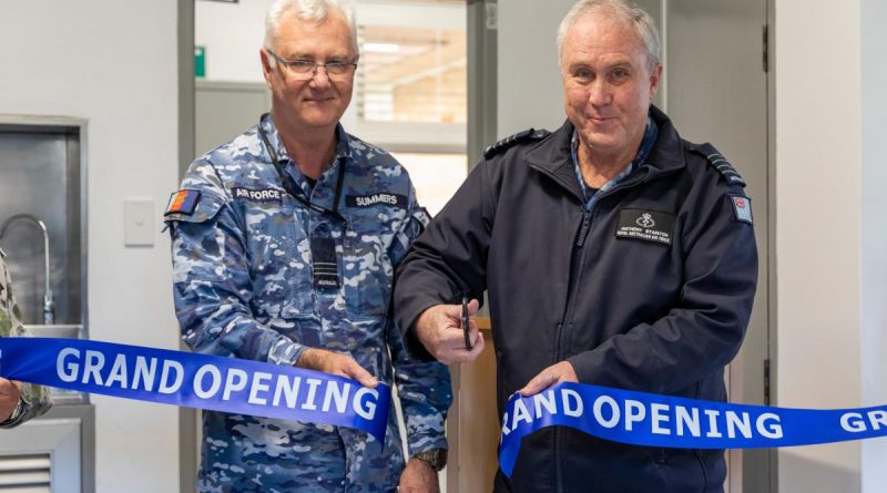 Squadron Leader Paul Summers, left, and Group Captain Anthony Stainton cut the ribbon at the grand opening of the Williamtown Allied Health Services building. Story by Corporal Melina Young. Photo by Leading Aircraftman Samuel Miller.