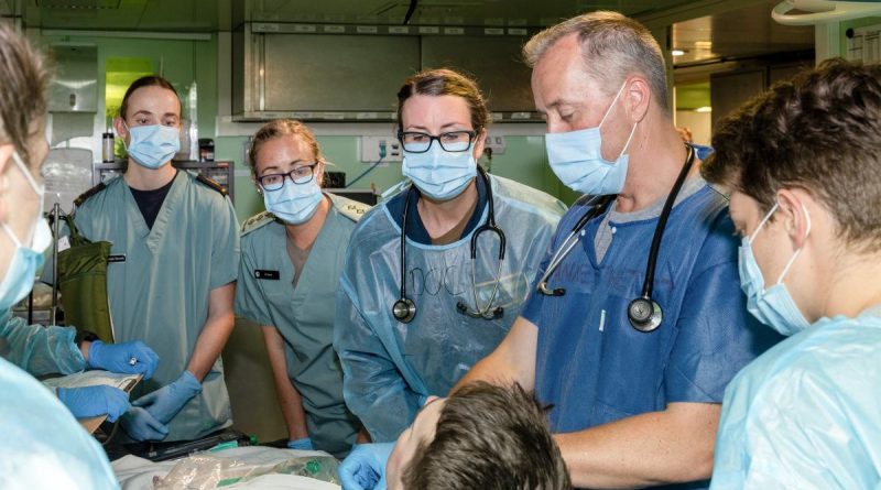 Personnel from HMAS Canberra’s medical team take part in a simulated resuscitation exercise in the ship’s resuscitation bay during Exercise Rim of the Pacific (RIMPAC) 2022. Story by Lieutenant Nancy Cotton. Photo by Leading Seaman Matthew Lyall.