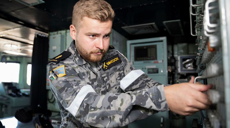 Able Seaman Electronics Technician Edward Simcock works on the navigation system on the bridge of HMAS Warramunga while on deployment. Story by Lieutenant Max Logan. Photo by Leading Seaman Daniel Goodman.