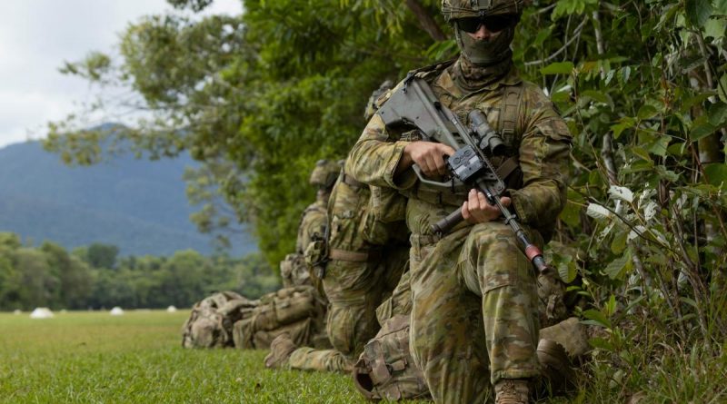 A soldier from the 3rd Battalion, Royal Australian Regiment, provides security at Jungle Training Wing, Tully, during Exercise Kalimantan. Story by Captain Diana Jennings. Photo by Bombardier Guy Sadler.