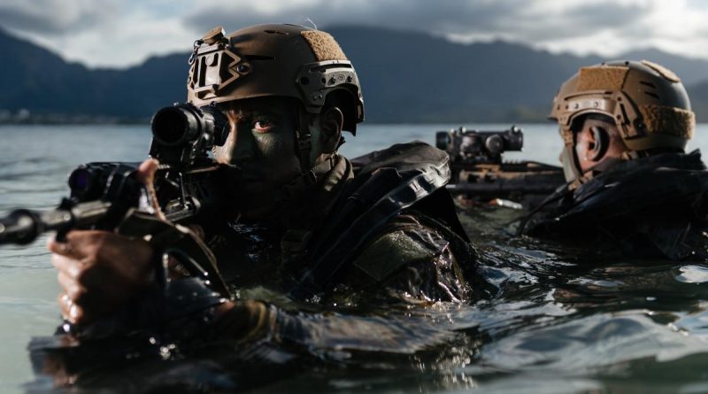 Soldiers from 2RAR secure a beach as part of a small-boat operations activity during RIMPAC. Photos: Corporal John Solomon.
