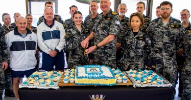 Commanding Officer HMAS Stirling Captain Gary Lawton cuts HMAS Stirling's birthday cake with the bases youngest member Seaman Amity Coyer. Story by Lieutenant Gary McHugh. Photo by Lieutenant Gary McHugh.