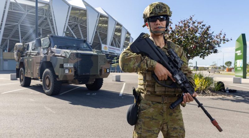 Army Reservist Private Abbas Foladi, from the 25/49 Battalion, Royal Queensland Regiment, patrols the grounds of the Queensland Country Bank Stadium as part of Exercise Austral Shield 2022 in Townsville. Story by Lieutenant Geoff Long. Photo by Corporal Jonathan Goedhart.