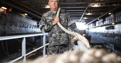 Lieutenant Commander David Gould, First Lieutenant of HMAS Canberra, squares away lines as the ship conducts Exercise Rim of the Pacific (RIMPAC) 2022 in the Pacific Ocean. Story by Lieutenant Nancy Cotton. Photo by Leading Seaman Matthew Lyall.