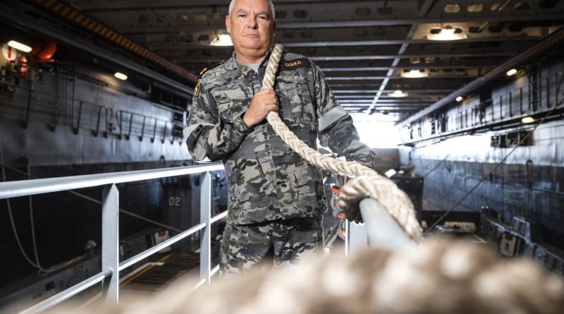 Lieutenant Commander David Gould, First Lieutenant of HMAS Canberra, squares away lines as the ship conducts Exercise Rim of the Pacific (RIMPAC) 2022 in the Pacific Ocean. Story by Lieutenant Nancy Cotton. Photo by Leading Seaman Matthew Lyall.