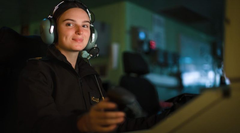 Able Seaman Miranda McLaughlin operates the combat system consoles in the operations room of HMAS Canberra during Exercise Rim of the Pacific (RIMPAC) 2022. Story by Lieutenant Nancy Cotton. Photo by Leading Seaman Matthew Lyall.
