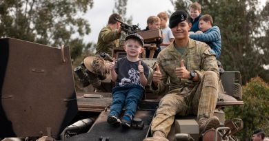 Australian Army troopers from the 2nd/14th Light Horse Regiment interact with members of the community during a heavy vehicle capability display as part the Gallipoli Barracks Open Day 2022, Brisbane. Story by Captain Cody Tsaousis. Photo by Corporal Nicole Dorrett.
