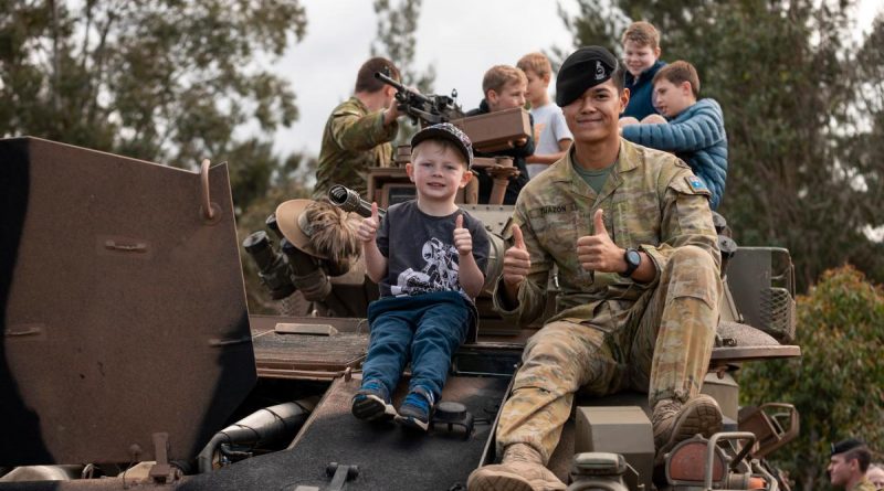 Australian Army troopers from the 2nd/14th Light Horse Regiment interact with members of the community during a heavy vehicle capability display as part the Gallipoli Barracks Open Day 2022, Brisbane. Story by Captain Cody Tsaousis. Photo by Corporal Nicole Dorrett.