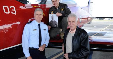 Pilot Officer Mitchell Kennedy, centre, with his father, grandfather and photo of his great-grandfather next to a PC-21 aircraft at RAAF Base Pearce. Story by Corporal Jacob Joseph. Photo by Chris Kershaw.