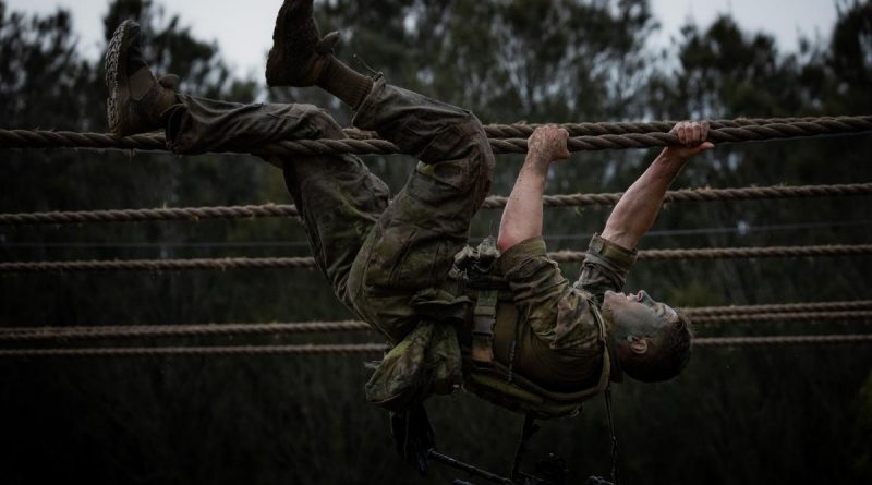 An Australian Army soldier from the 6th Battalion, Royal Australian Regiment, moves across the traverse ropes during an obstacle course activity held as part of the Duke of Gloucester Cup in Singleton. Story by Corporal Jacob Joseph. Photo by Corporal Madhur Chitnis.