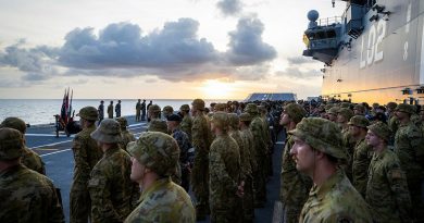 HMAS Canberra’s (III) Ships Company parade on the flight deck of during a commemorative service for 80th anniversary of the Battle of Savo Island. Story by Lieutenant Nancy Cotton. Photo by Leading Seaman Matthew Lyall.