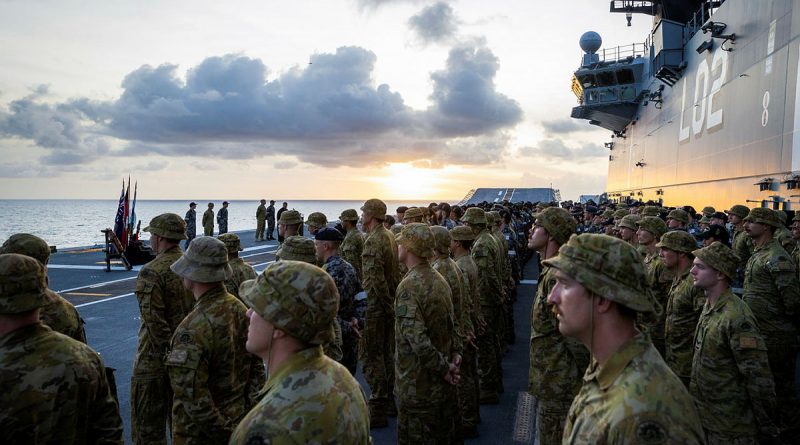 HMAS Canberra’s (III) Ships Company parade on the flight deck of during a commemorative service for 80th anniversary of the Battle of Savo Island. Story by Lieutenant Nancy Cotton. Photo by Leading Seaman Matthew Lyall.