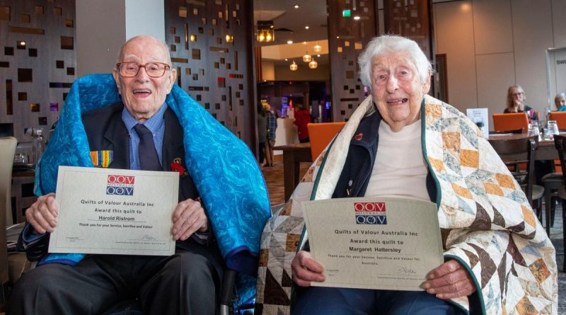 WW2 veterans Harold “Hiram” Ristrom and Margaret Hattersley receive handmade quilts from the Quilts of Valour Foundation during a lunch held at the Bentleigh RSL, Victoria. Story by Corporal Melina Young. Photo by Leading Seaman James McDougall.