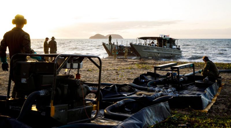 Petroleum Operators from the 17th Sustainment Brigade pump fuel from an LCM8 to land Cowley Beach Training Area in Queensland. Story and photo by Captain Thomas Kaye.