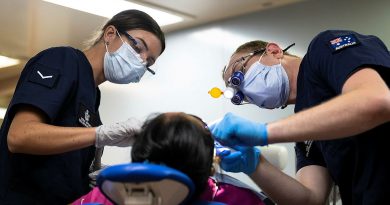 Air Force Dentist Flight Lieutenant Jack O'Neill (right) and Dental Assistant Leading Aircraftwoman Ocean Mitchell perform a dental procedure onboard United States Hospital Ship USNS Mercy during Pacific Partnership 2022 in Palawan, Philippines. Story by Captain Sarah Kelly. Photo by Corporal Brandon Grey.