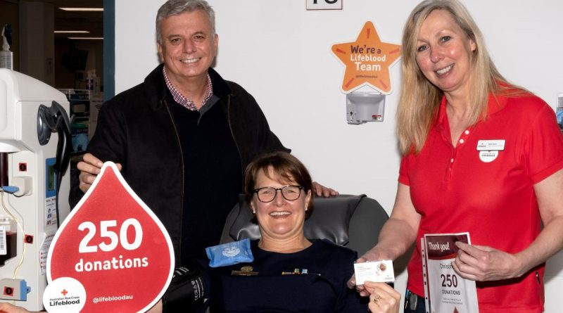 Flight Sergeant Christine Williams, with her husband Warren, at the Lifeblood Canberra Garran Donor Centre on the occasion of her 250th blood donation. Story by John Noble. Photo by Flight Sergeant Kev Berriman.