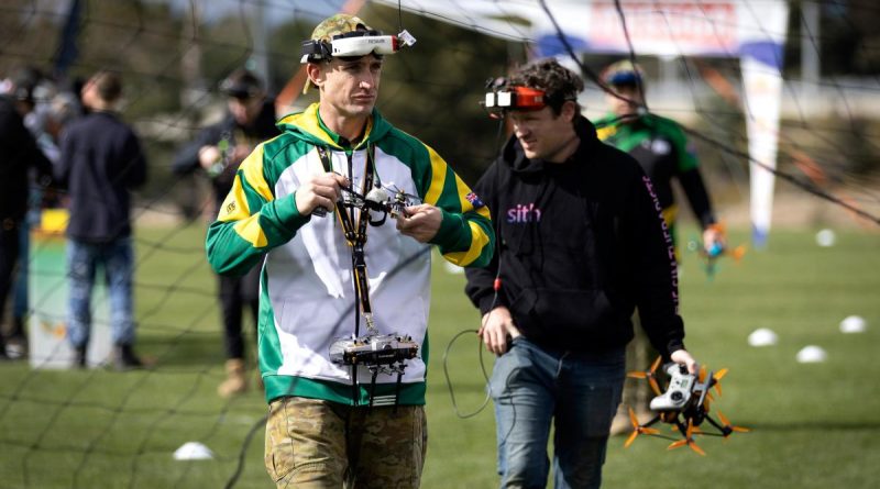 Australian Army soldier Lance Bombardier Riley Van Leeuwen from the 131st Surveillance and Target Acquisition Battery returns from retrieving his racing drone from the track during the Drone Racing National Championships. Story and photo by Sergeant Matthew Bickerton.