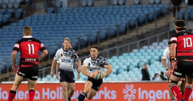 Able Seaman Manuel Grundy-Quay runs the ball as the Navy Tridents play Fire and Rescue NSW in the Community Cup Rugby League game at Accor Stadium in Sydney. Photo by Leading Seaman Daniel Goodman.