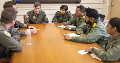 Members of the Royal Australian Air Force and Indian Navy P-8 flight teams chat during a combined crew training discussion at Joint Base Pearl Harbor-Hickam during Exercise Rim of the Pacific (RIMPAC) 2022. Story and photo by Leading Seaman Kylie Jagiello.