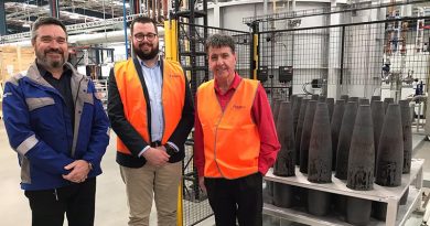 Rheinmetall NIOA Munitions project manager Jeff Crabtree, left, with RNM director Jackson Nioa and Member for Maryborough Bruce Saunders and the first projectiles to come out of the $60m shell forging plant in Maryborough, Queensland. Supplied.