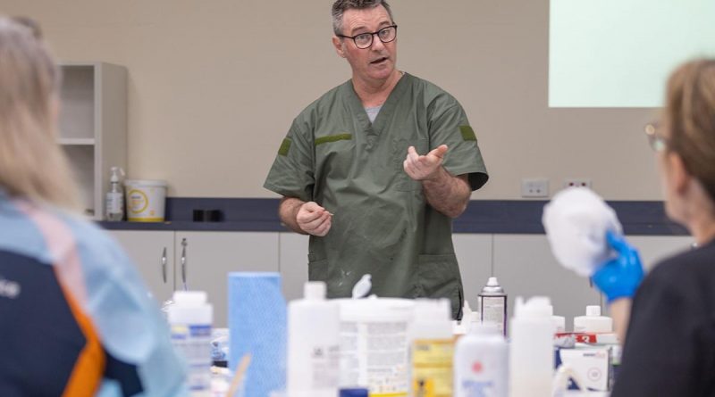 Major Paul Krohn teaching clinicians how to make silicone wound prosthetics. Story by Captain Thomas Kaye.