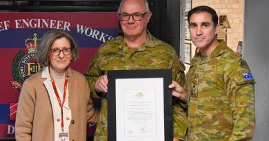 WO2 Simon Lovell, centre, is presented with a Federation Star for 40 years of service by Chief of Army Lieutenant General Simon Stuart at Randwick Barracks, in the presence of his wife, Teresa Lovell. Story by Captain Evita Ryan. Photo by Corporal James Davison.