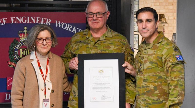 WO2 Simon Lovell, centre, is presented with a Federation Star for 40 years of service by Chief of Army Lieutenant General Simon Stuart at Randwick Barracks, in the presence of his wife, Teresa Lovell. Story by Captain Evita Ryan. Photo by Corporal James Davison.