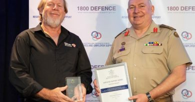 Randall Cook, left, from the School of Sport Education NT, receives his award from Head Joint Support Services Division Major General Douglas Laidlaw at the Employer Support Awards held in Darwin. Story by Flight Lieutenant Nick O’Connor. Photo by Sergeant Pete Gammie.