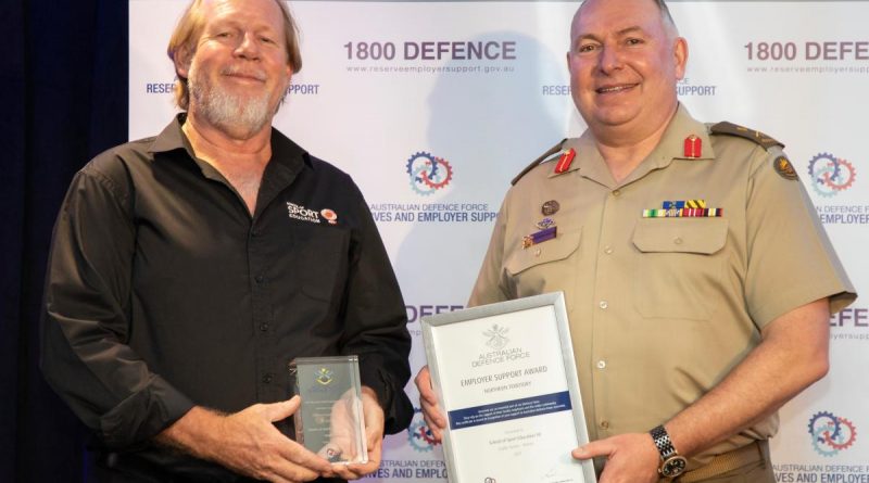 Randall Cook, left, from the School of Sport Education NT, receives his award from Head Joint Support Services Division Major General Douglas Laidlaw at the Employer Support Awards held in Darwin. Story by Flight Lieutenant Nick O’Connor. Photo by Sergeant Pete Gammie.