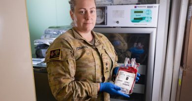 Lieutenant Melissa Osmand inspects packed red blood cells stored in a dedicated blood fridge on board HMAS Canberra. Story by Lieutenant Nancy Cotton. Photo by Leading Seaman Matthew Lyall.