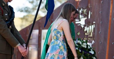 Lance Corporal Rick Milosevic's partner, Kelly Walton, and their daughter lay a wreath at 'Rick's Jump Up' memorial in Quilpie. Story by Captain Taylor Lynch. Photo by Major Roger Brennan.