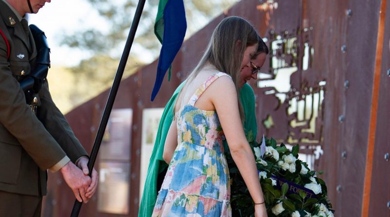 Lance Corporal Rick Milosevic's partner, Kelly Walton, and their daughter lay a wreath at 'Rick's Jump Up' memorial in Quilpie. Story by Captain Taylor Lynch. Photo by Major Roger Brennan.