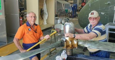 Warrant Officer Kevin ‘Skeet’ Parker, left, removing the dome nut from a propeller in the paint shop at the RAAF Townsville Aviation Heritage Centre. Story by Flight Lieutenant Karyn Markwell. Photo by Flight Sergeant Michael Hartley.