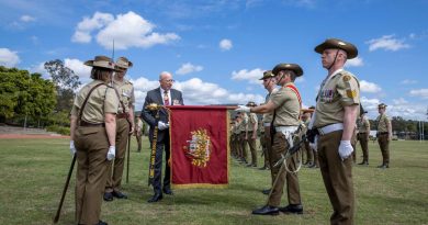 The Governor-General, General (retd) Sir David Hurley, attaches the Streamer, East Timor 1999-2003, to the Princess Anne banner during the 1st Signal Regiment honours parade at Gallipoli Barracks, Brisbane. Story by Captain Jessica O’Reilly. Photo by Corporal Nicole Dorrett.