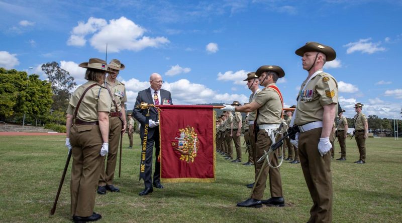 The Governor-General, General (retd) Sir David Hurley, attaches the Streamer, East Timor 1999-2003, to the Princess Anne banner during the 1st Signal Regiment honours parade at Gallipoli Barracks, Brisbane. Story by Captain Jessica O’Reilly. Photo by Corporal Nicole Dorrett.