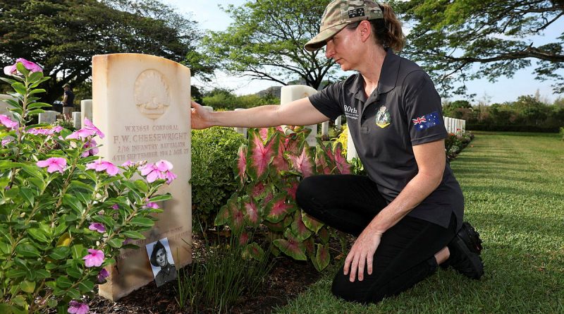 Army nursing officer Lieutenant Lorraine Cheesewright pays her respects at the grave of her great uncle, Corporal Frederick Cheesewright at the Port Moresby (Bomana) War Cemetery in Papua New Guinea. Story and photo by Warrant Officer Class Two Max Bree.