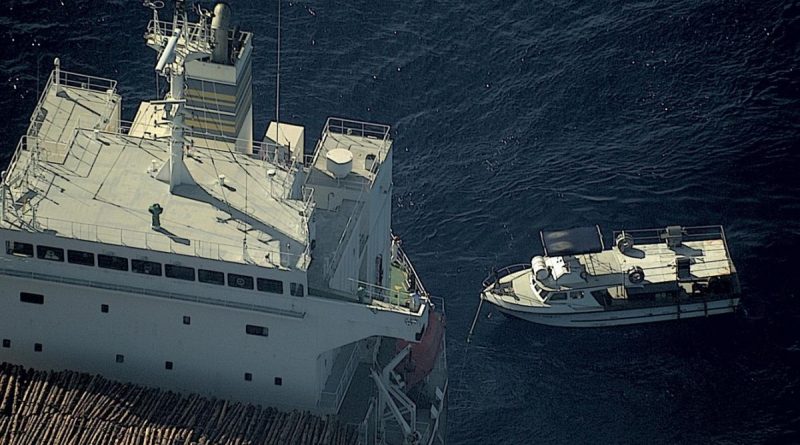 Distressed vessel Ogoi Ratz, left, made ready for towing by civilian merchant vessel Uni Sunshine after being located by RAAF P-8A Poseidon maritime patrol aircraft. Story by Leading Seaman Kylie Jagiello. Photo from RAAF No. 11 Squadron.