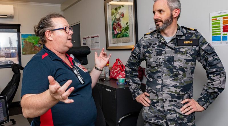 Tracey Small, left, gives Lieutenant Roderick Thiele a tour of the Darwin harbour control office during Exercise Kakdau 2022. Story by Lieutenant George Cross. Photo by Leading Seaman Shane Cameron.