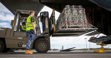 Air Force mobile air load team aviators from No 22 Squadron load liquefied petroleum gas tanks into a C-130J Hercules aircraft at Port Macquarie, New South Wales. Story by Flight Lieutenant Bronwyn Marchant. Photo by Leading Aircraftman Chris Tsakisiris.