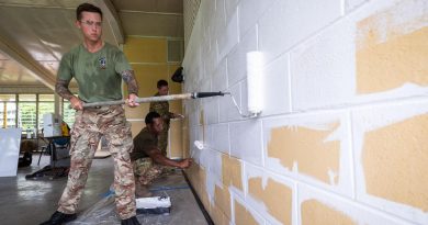 British Army Lance Corporal Shane Bundy, left, PNGDF Lance Corporal Clement Nibabe, kneeling, and Australian Army Sapper Anthony Toigo, paint the guardhouse walls during Exercise Puk Puk at Goldie River Training Depot. Story by Major Jesse Robilliard. Photo by Sergeant Nunu Campos.