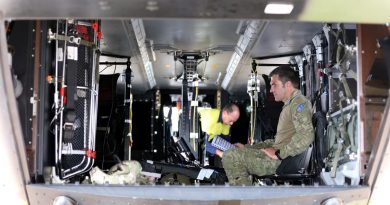 Major Waldo Britz prepares test equipment on a 5th Aviation Regiment MRH90 Taipan helicopter at RAAF Base Townsville. Story by Lieutenant Akhil Kambil and Captain Carolyn Barnett. Photo by Corporal Lisa Sherman.