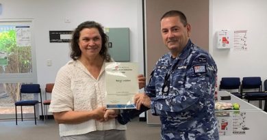 Defence civilian Beryl Webber receives her graduation certificate after successfully completing the Certificate II in Security Operations course at RAAF Base Tindal, Northern Territory. Story by Sarah-Kate Melehan.