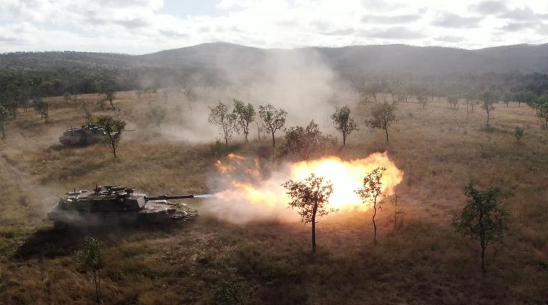 Soldiers from the 2nd Cavalry Regiment fire the M1 Abrams tank during a manoeuvre serial on Exercise Brolga Sprint at Townsville field training area, Queensland. Story by Captain Diana Jennings. Photo by Brigadier Guy Sadler.