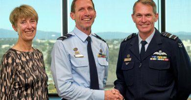 Chief of Air Force Air Marshal Robert Chipman, right, congratulates Air Vice Marshal Steve Edgeley on receiving his Doctor of Philosophy (PhD). Also in attendance was Air Vice Marshal Edgeley's wife, Pippa Edgeley. Story by John Noble. Photo by Flight Sergeant Kev Berriman.